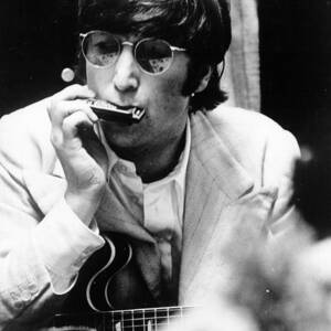 Musician John Lennon Smoking by Bettmann