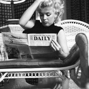 Marilyn Relaxes In A Hotel Room by Michael Ochs Archives