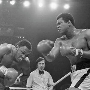 Muhammad Ali Punching Joe Frazier by Bettmann