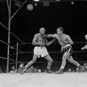 Rocky Marciano Boxing Joe Walcott by Bettmann