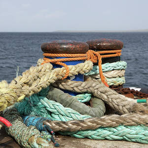 Ropes Tied Around Metal Bollards In A by Joe Fox Ropes Tied Around Metal Bollards In A by Joe Fox