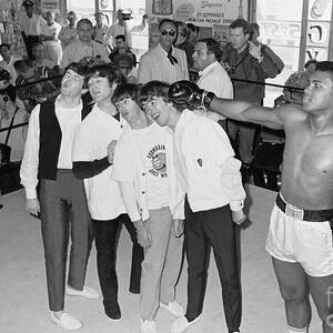 The Beatles Training With Boxer Cassius by Bettmann