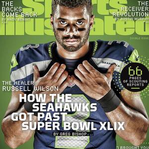 The Healer Russell Wilson 2015 Nfl Football Preview Issue Sports Illustrated Cover by Sports Illustrated