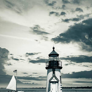 Usa, Nantucket, Massachusetts, New England, Black And White Brant Point Lighthouse With A Sailboat. by Alejandra Uribe Posada