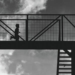 Boy running on highway bridge in Guatemala BW by Tatiana Travelways